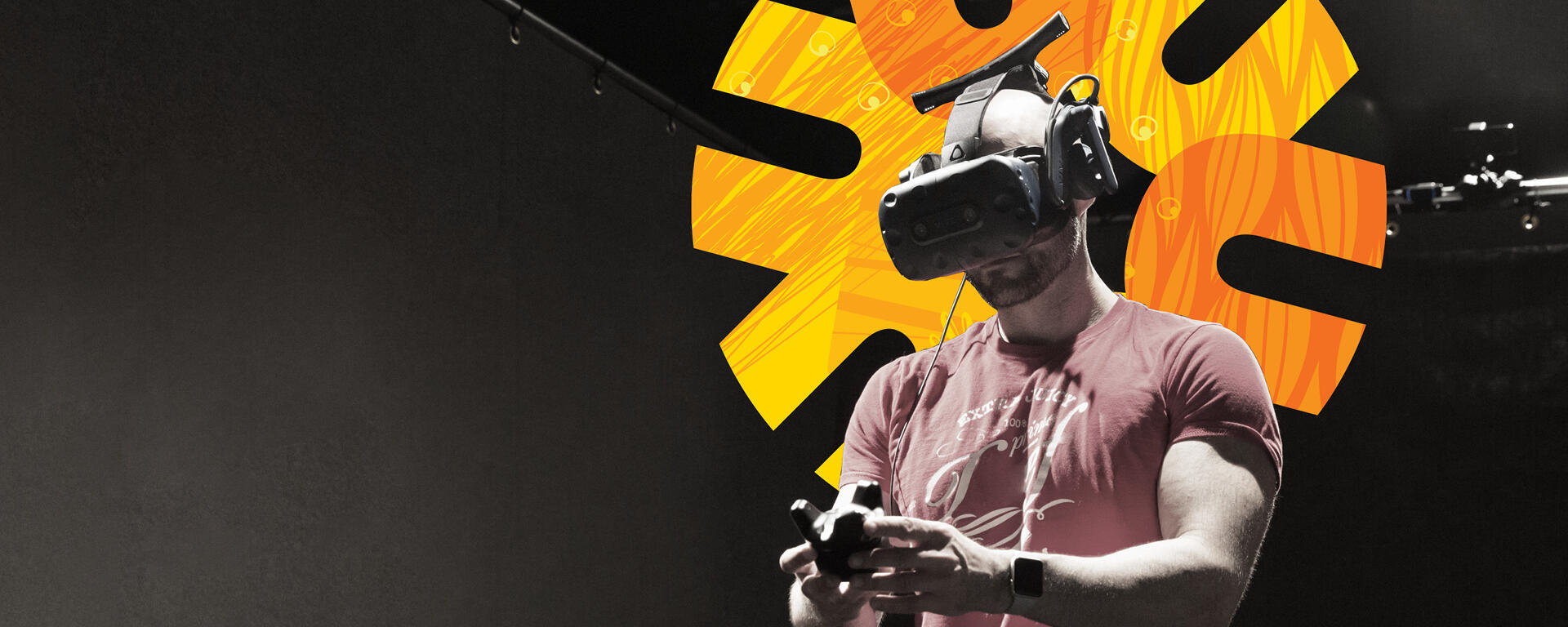 Guy in VR with UCalgary spark logo behind him