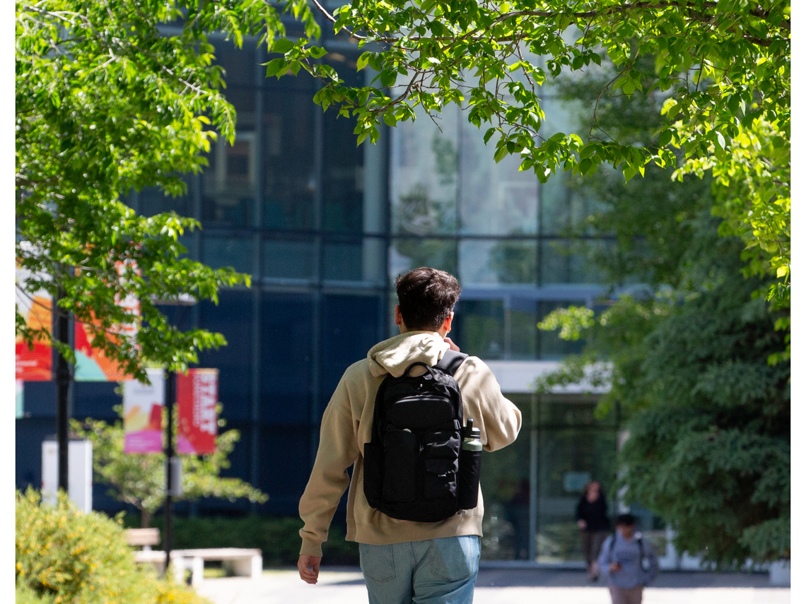 Student walking outside on campus
