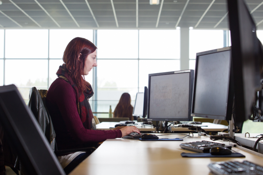 Woman working on a desktop computer